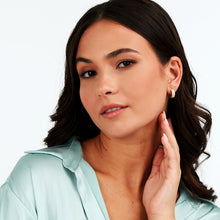 Load image into Gallery viewer, tesori huggie earrings 925 silver white cz with 18k gold plating
